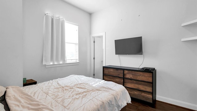 bedroom featuring dark wood-type flooring