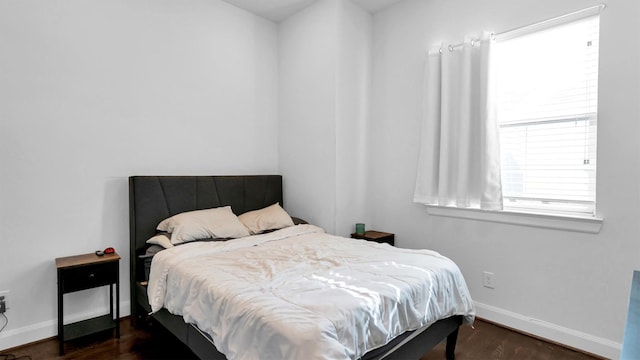 bedroom featuring dark wood-type flooring