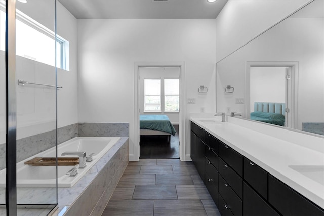 3111 Leeland St, Houston, TX 77003 - ensuite bathroom with a garden tub, plenty of natural light, and double vanity