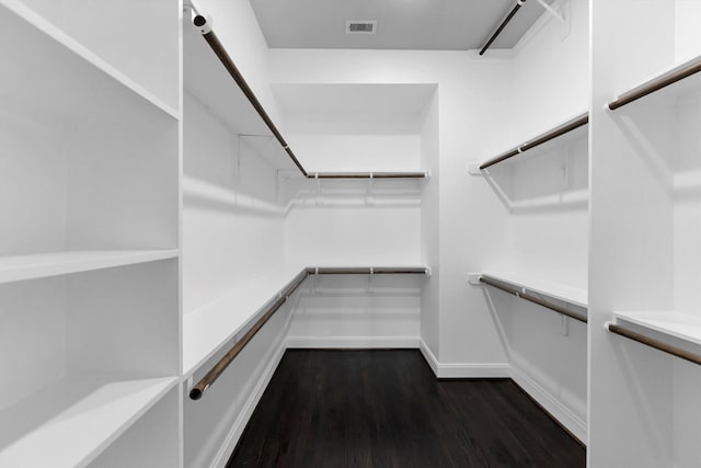 3111 Leeland St, Houston, TX 77003 - walk in closet featuring dark wood-type flooring