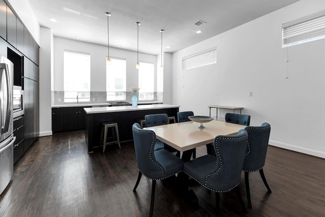 3111 Leeland St, Houston, TX 77003 - dining room with dark wood finished floors, recessed lighting, and baseboards