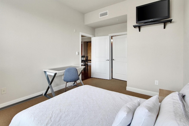 300 St Joseph Pkwy Unit 318, Houston, TX 77002 - bedroom with dark carpet and baseboards