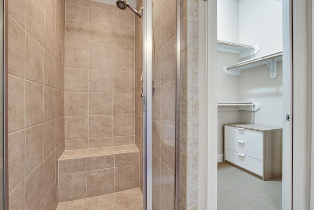 bathroom with tiled shower