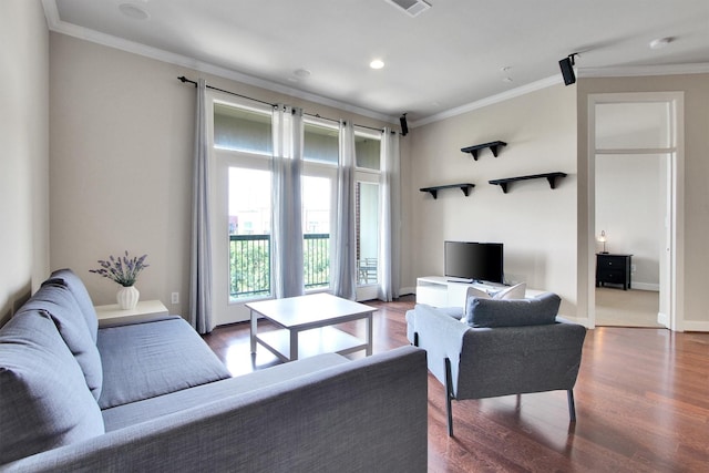 living room with dark hardwood / wood-style floors and ornamental molding