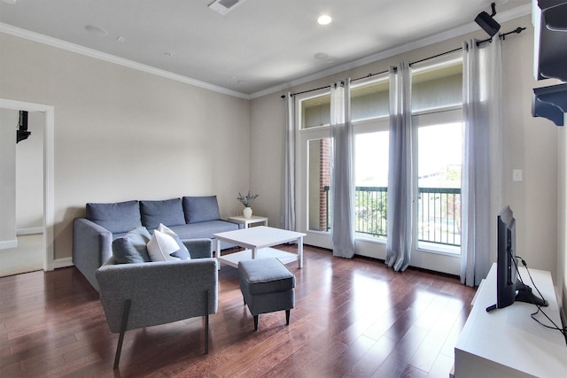 living room featuring dark wood-type flooring and ornamental molding