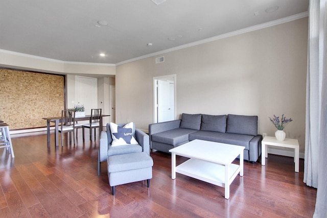 living room with dark hardwood / wood-style flooring, a baseboard heating unit, and ornamental molding