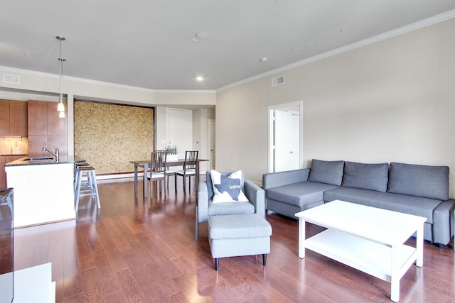 300 St Joseph Pkwy Unit 318, Houston, TX 77002 - living area featuring dark wood-style floors, ornamental molding, and recessed lighting