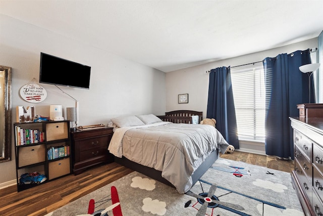 bedroom featuring dark hardwood / wood-style flooring