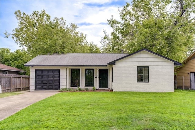 ranch-style home featuring a garage and a front lawn