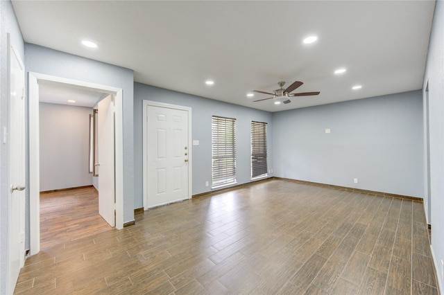 empty room with wood-type flooring and ceiling fan