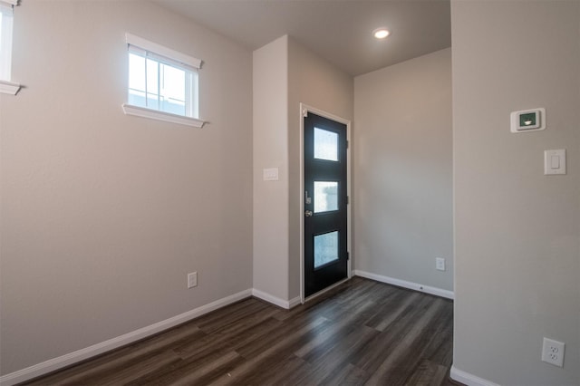 foyer with dark hardwood / wood-style floors