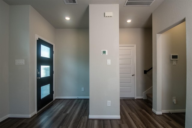 entryway with dark hardwood / wood-style floors