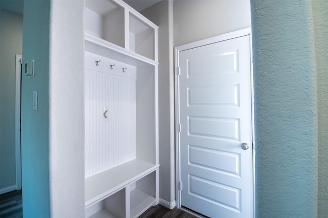 mudroom with dark hardwood / wood-style flooring