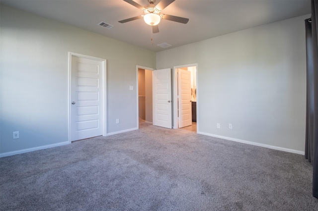 unfurnished bedroom with ceiling fan, a closet, carpet floors, and ensuite bathroom