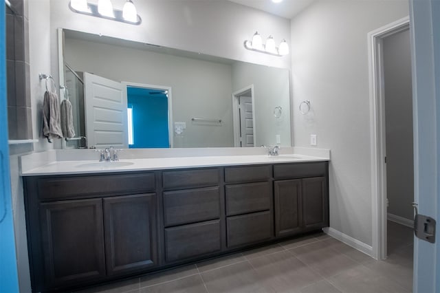 bathroom with vanity and tile patterned floors