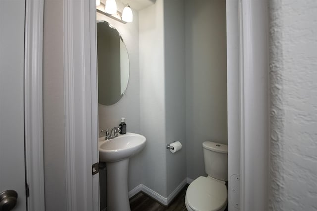 bathroom with toilet and sink