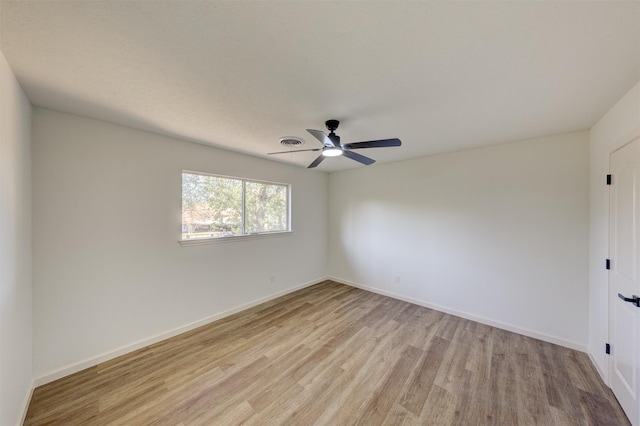 unfurnished room featuring ceiling fan and light hardwood / wood-style flooring