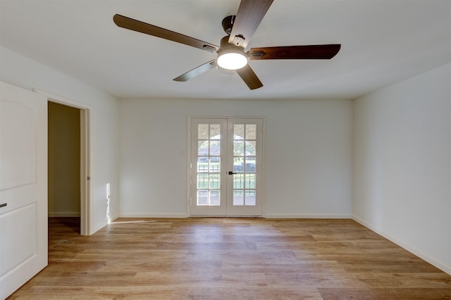 spare room with french doors, light hardwood / wood-style flooring, and ceiling fan