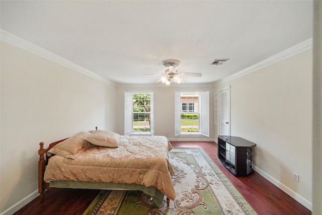 bedroom featuring ceiling fan, ornamental molding, and hardwood / wood-style flooring