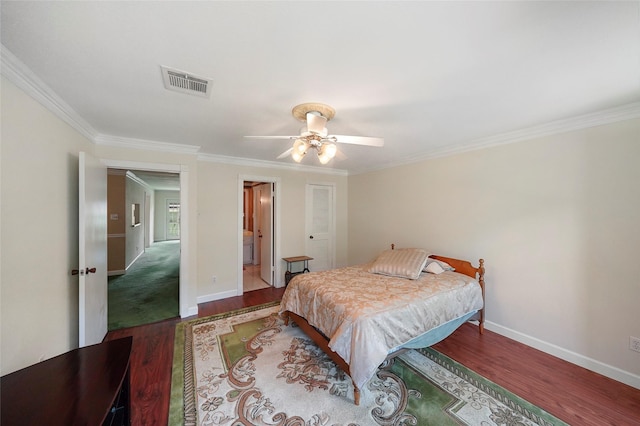 bedroom featuring wood-type flooring, ceiling fan, and crown molding