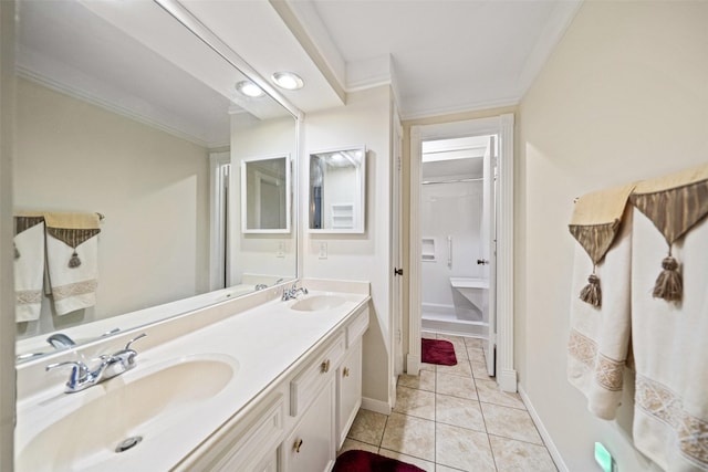 bathroom with vanity, tile patterned floors, and crown molding