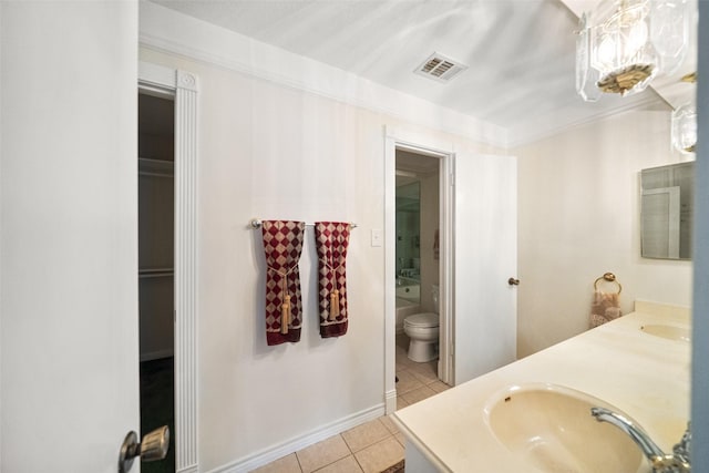 bathroom with tile patterned floors, vanity, and toilet