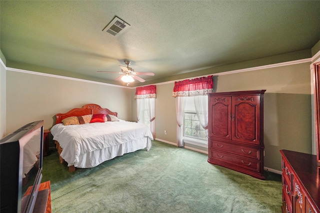 carpeted bedroom featuring a textured ceiling and ceiling fan