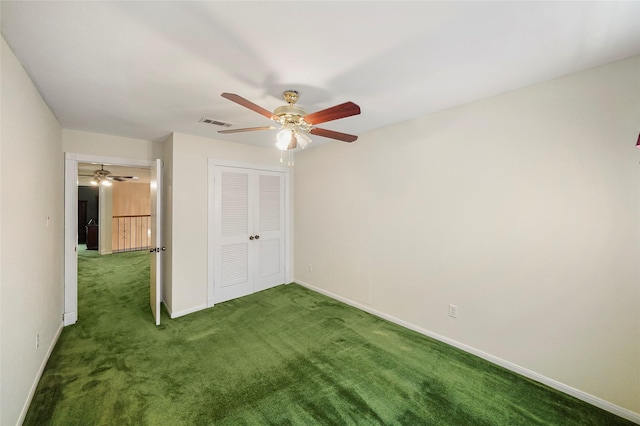 unfurnished bedroom with carpet flooring, ceiling fan, and a closet