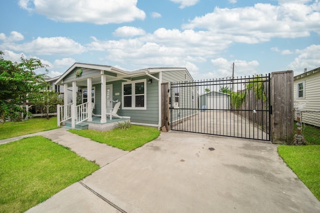 view of front of home featuring covered porch and a front yard