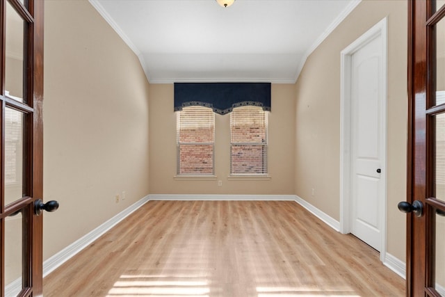 spare room with light hardwood / wood-style floors and ornamental molding