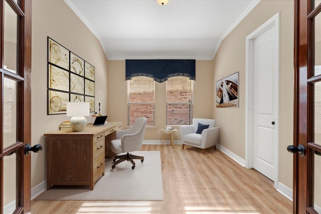 office area featuring plenty of natural light, light wood-type flooring, and crown molding