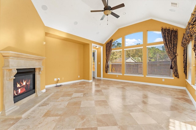 unfurnished living room with a high end fireplace, ornamental molding, ceiling fan, and lofted ceiling