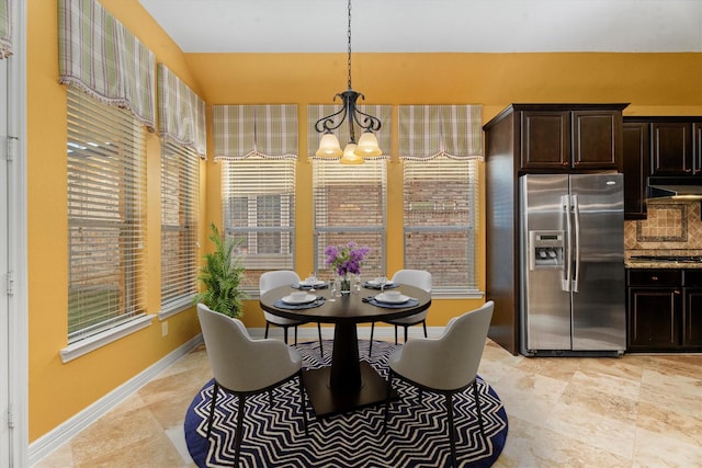 dining space featuring a chandelier