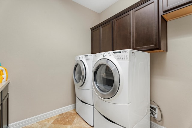 laundry area with cabinets and independent washer and dryer