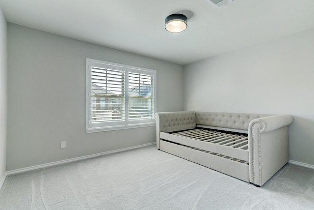 bedroom with light carpet