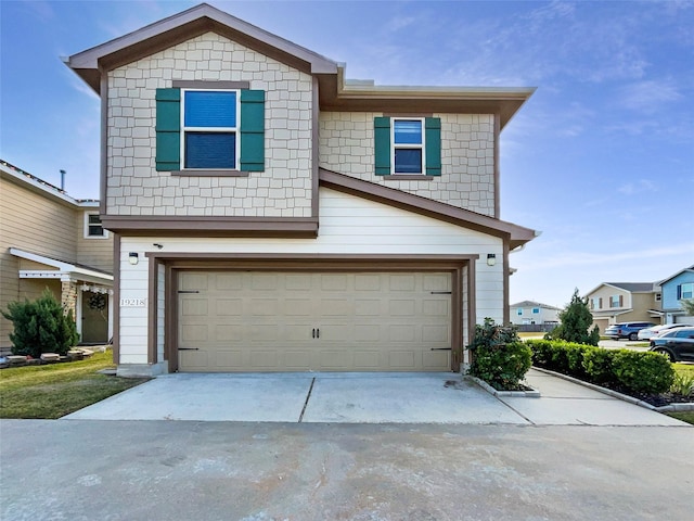 view of front of property with a garage