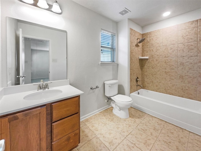 full bathroom featuring tile patterned floors, vanity, toilet, and tiled shower / bath