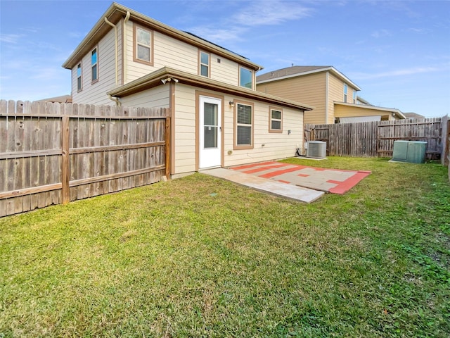 back of property featuring central AC, a yard, and a patio