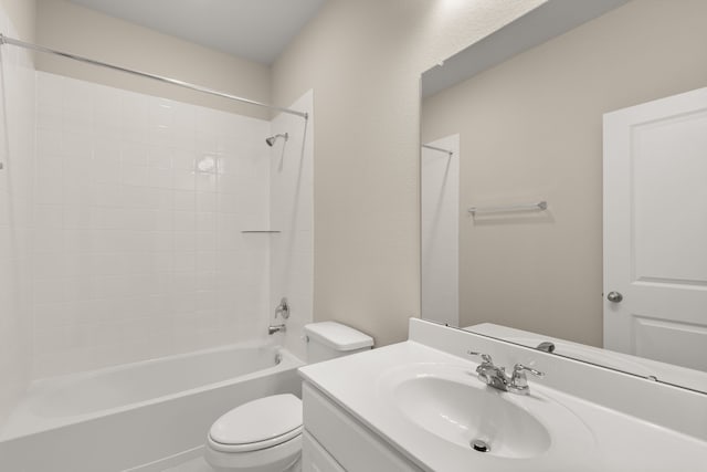 full bathroom with vanity, toilet, and tiled shower / bath