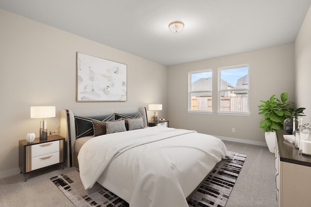 bedroom with light colored carpet