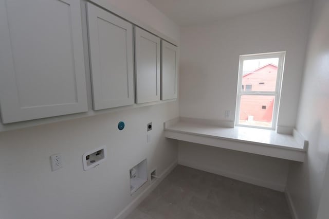 laundry area featuring washer hookup, cabinets, and electric dryer hookup