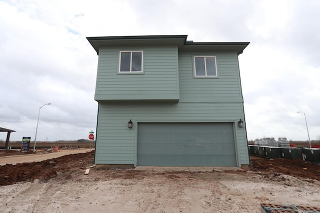 view of property exterior with a garage