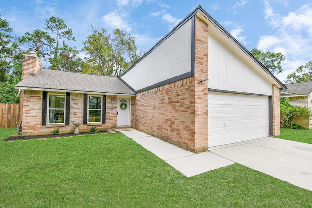 view of front of home featuring a garage and a front lawn