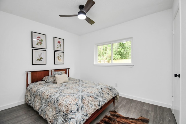 bedroom featuring ceiling fan and dark wood-type flooring