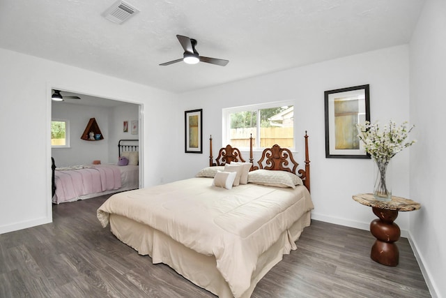 bedroom featuring ceiling fan and dark hardwood / wood-style flooring