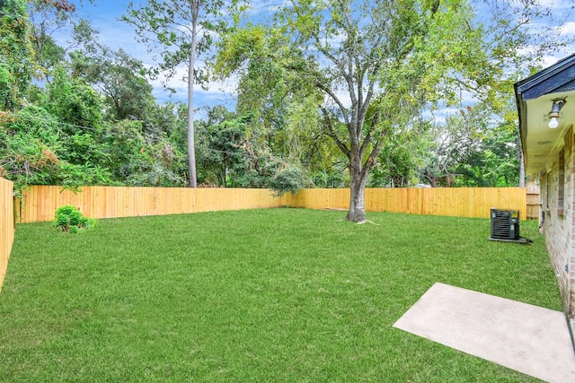 view of yard featuring central AC