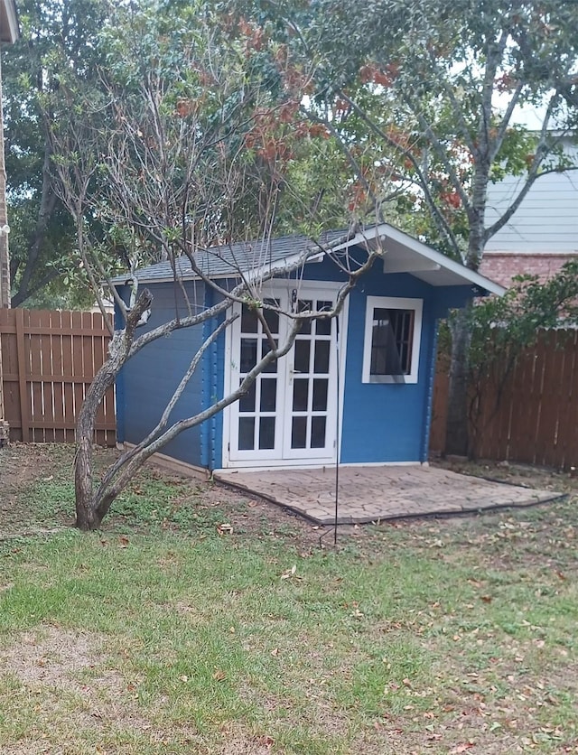 view of outdoor structure with a lawn