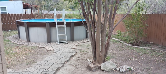 view of yard with a fenced in pool