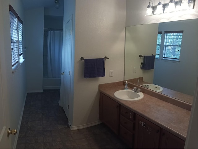 bathroom featuring vanity and shower / bath combination with curtain