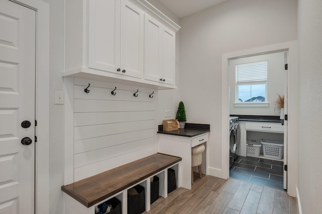 mudroom featuring washer and dryer and wood-type flooring